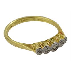 Early 20th century illusion set five stone diamond ring, with scroll design gallery, stamped 18ct PT
