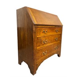 Georgian style oak bureau, fall front enclosing fitted interior, three drawers to base, raised on stile supports W91cm