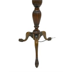20th century stained beech standard lamp of classical design, with fluted turned column carved with water leaves, raised on three splayed supports with ball and claw feet, together with a decorative shade H180cm including shade H180cm
