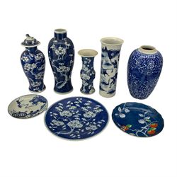Group of Chinese blue and white ceramics, including sleeve vase decorated with a warriors on horseback, three prunus decorated vases, prunus dish and two other dishes