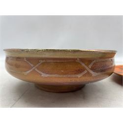 Royal Lancastrian lustre bowl, the centre decorated with a dragonfly in relief and chain pattern to the exterior, together with a mottled orange plate, both painted by Gladys Rodgers, bowl D18cm (2)