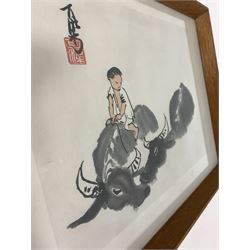 Circle of Li Keran (Chinese 1907-1989): Shepherd Riding Water Buffaloes, ink and wash on paper signed with artists seal 25cm x 33cm