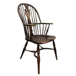 Ash and elm Windsor armchair, the splat and spindle back over elm seat, raised on turned supports, united by stretchers  