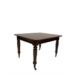 Victorian mahogany pull-out action extending dining table, the extendable top with one additional leaf, raised on turned supports, terminating in ceramic castors 