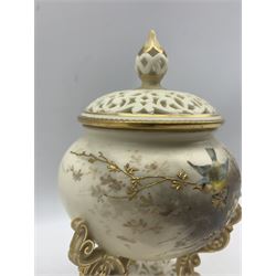 Late Victorian Grainger & Co Royal China Works Worcester reticulated pot pourri vase and cover, the bulbous body hand painted with two birds perched on a gilt-heightened branch, upon three scroll supports, with pierced lobed base and domed cover, brown printed marks beneath including shape number 474 H