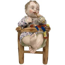 Pair of Art Deco Hungarian bookends by Komlós, modelled as a seated girl and boy, H16cm together with a pair of Continental porcelain models of infants in high chairs, H22cm 