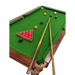 E.J. Riley Ltd. of Accrington - early 20th century mahogany 'rise and fall' snooker table, adjustable height with moulded dining table leaves, turned and fluted supports