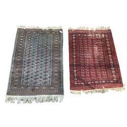 Afghan Bokhara rug of traditional guls design on a blue field with borders, together with Bokhara with red field 