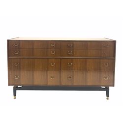 G-Plan - 'Librenza' tola wood sideboard, fitted with eight drawers, raised on an ebonized base with brass feet. W 150cm, D 46cm, H 86cm.