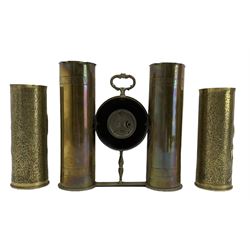 World War I Trench Art clock formed from two brass shell cases H28cm and a pair of Trench Art vases with a raised pattern of Art Nouveau flowers (3)