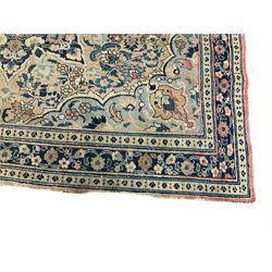 Antique Persian Nain indigo and ivory rug, central lotus medallion surrounded by scrolling vines of palmette and foliate motifs, the guarded border with repeating trailing flower heads
