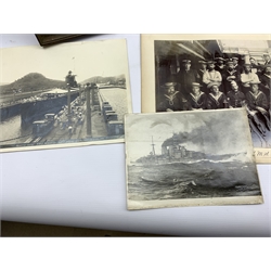 Frame containing six black and white photographs 'German Submarines off Harwich, handed over to the British Jan 1919', photograph of the Petty Officers of H.M.S. Dido, photograph of S.S. Marathon with signatures, two other Naval photographs and a card for the Review of the Fleet at Spithead June 1902