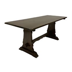 20th century oak refectory table, the rectangular top raised on panel end supports with sledge feet, united by a stretcher 