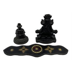 Two Victorian black painted cast iron doorstops H23cm max, together with a set leather backed horse brasses, L44cm