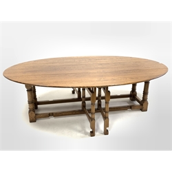 17th century style drop leaf wake dining table, the oval top raised on ring turned and block supports, each leaf having a double gate leg action