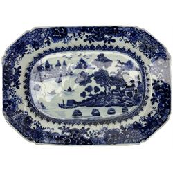 18th century Chinese Export blue and white serving dish, of rectangular canted form, decorated with scenes of peonies and other flowers amid rockwork in a fenced garden L26.5cm, and two similar examples, the first decorated with a river landscape and the second with pagodas in a mountainous landscape, largest L29cm (3)