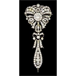 Late 18th / early 19th century French silver and paste stomacher pendant brooch, central cluster within a pierced floral spray and suspending a ribbon bow pendant drop, French marks