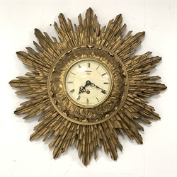 Smiths giltwood starburst wall clock, with white enamel dial and Roman numeral chapter ring, eight day single train movement, W43cm