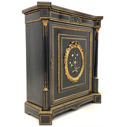 Victorian ebonised pier cabinet, the brass strung frieze centred by inlaid floral hardstones and floral cast gilt metal mounts over a fielded panelled door with similar inlay, enclosing two shelves, flanked by leaf cast brass capped and fluted pilasters, W98cm, H107cm, D44cm
