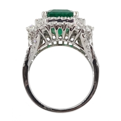 18ct white gold emerald and double halo diamond cluster ring, with diamond set shoulders, hallmarked, emerald 4.86 carat, total diamond weight approx 1.70 carat