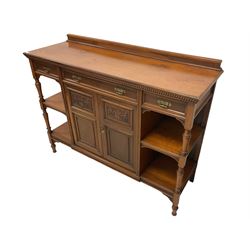 Late Victorian walnut buffet sideboard, raised back, the gadroon moulded top over three pine lined drawers, shelves and double cupboard, the cupboard enclosed by panelled doors with carved foliate and cartouche decoration