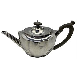 George III silver oval teapot of panel sided design,reeded body and spout, stained handle and lift London 1799 Maker Daniel Pontifex