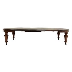Victorian mahogany extending dining table, the extendable wind-out top with three additional leaves, raised on turned and fluted supports, terminating in ceramic castors 