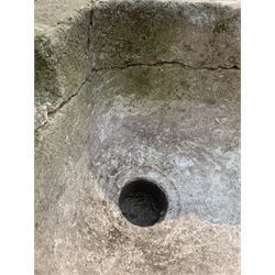 18th century limestone trough, having a sloped base and drainage hole, (W69cm) together with a small carved stone bowl planter or mortar (D26cm)