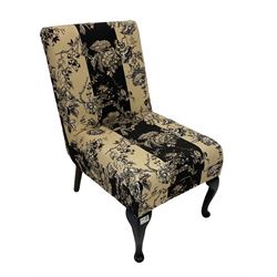Chair upholstered in black and cream fabric 