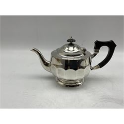 Silver three piece tea set of panel sided circular form, the teapot with ebonised handle and lift Sheffield 1927 Maker Cooper Bros. and a similar hot water jug Sheffield 1931 Maker Viners 38oz gross (4)