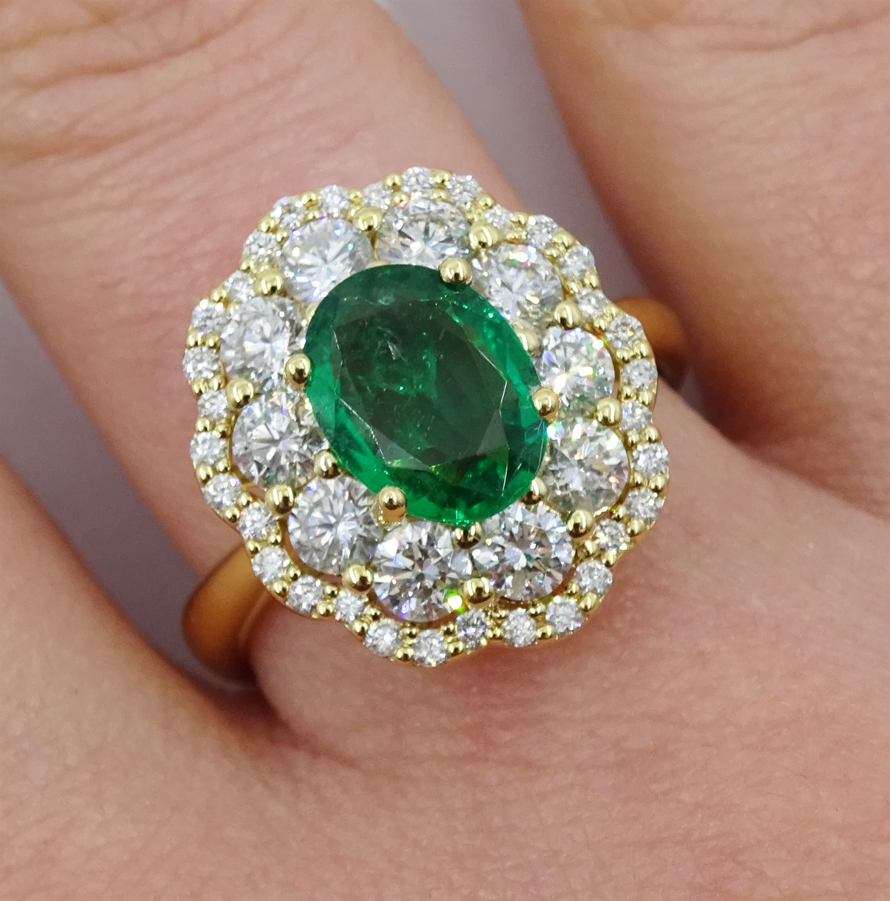 18ct gold oval emerald and diamond cluster ring, stamped 750, emerald ...
