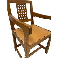 Knightman - pair of oak carver chairs, the lattice back panel over tan leather upholstered seat with stud work, raised on octagonal front supports, united by plain stretchers 