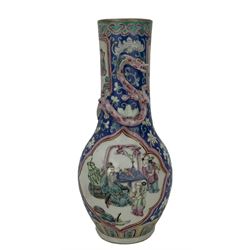 19th century Chinese famille rose vase, decorated with two lozenge shape reserves depicting figures in an interior setting and the other of figures feeding ducks, with applied pink glazed dragon to the neck and two further reserves on a scroll painted blue ground, unmarked, H26.5cm 