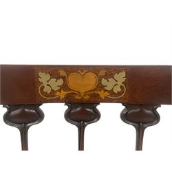 Possibly Liberty's of London - set of four late 19th century Art Nouveau chairs, the cresting rail inlaid with heart motifs and extending leaves in metal, three upright splats carved as stylised tulip flowers, floral needlework upholstered seats, on square supports with compressed splayed feet