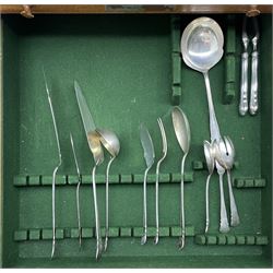Quantity of German silver cutlery, the stems of tapering serpentine outline and initialled 'R' comprising twelve large dessert spoons, twelve table forks, twelve fish forks, eight small dessert spoons, nine teaspoons, six coffee spoons, thirty five silver handled knives in various sizes, various serving implements, ladles etc 124 pieces with crescent and crown mark, some marked 800 and makers mark Dreyfuss approx 135oz excluding knives   in an oak five drawer cabinet