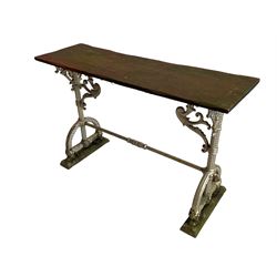 19th century cast iron and wooden side table, rectangular wooden top on cast iron base, twist moulded uprights with arched lower supports, scrolling foliate brackets, the two end supports united by stretcher