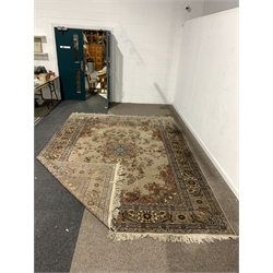 Persian design brown ground carpet, with floral medallion surrounded by interlaced foliate, double guarded border, 275cm x 375cm