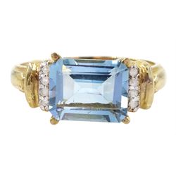 Gold emerald cut blue topaz and diamond ring, stamped 10K