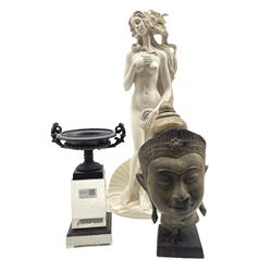 Cast metal urn on a perspex stand, composition figure and an Indian metal bust