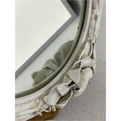 Victorian Royal Worcester glazed white Parian mirror, of oval form with moulded frame applied with flowers and foliage, with Royal Worcester back stamp and indistinct date code, possibly for 1868, in wooden easel frame with fretwork support, 36cm x 31cm, with an accompanying letter 