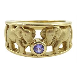 Gold elephant design ring, set with a single round tanzanite