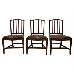 Set of four George III mahogany dining chairs, arched slat back, serpentine fronted drop-in seat upholstered in brown leather, on square moulded supports united by H-stretcher; early 19th century elbow chair, shaped moulded cresting rai lover pierced splat, upholstered drop in seat, on square tapering moulded supports (5)