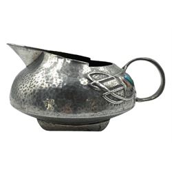 Arts and Crafts Tudric pewter jug for Liberty from a design by Archibald Knox, cast in low relief with Honesty plants and small enamel panels marked to base 0231 Rd 420290 H6cm