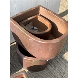 Seven composite rustic planters, four D shaped and three square tapering