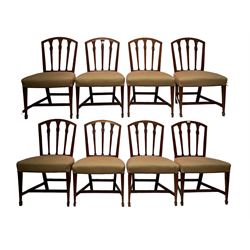 Set eight 19th century mahogany dining chairs, arched cresting rails above carved and fluted tapering splats with flower head motif, upholstered in contemporary geometric fabric, raised on square tapering supports with spade feet 