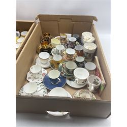 Royal Crown Derby Imari 2451 coffee cup and saucer, together with a quantity of porcelain tea/ coffee cups and saucers including Tuscan China, Crown Staffordshire, Royal Doulton, two 1911 commemorative beakers etc in two boxes
