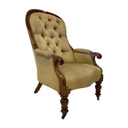 Late 19th century mahogany framed armchair, high spoonback upholstered in buttoned textured fabric with sprung seat, scrolled arm terminals raised on turned supports with castors