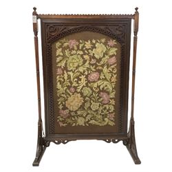 Victorian mahogany fire screen, the needlework panel enclosed by pierced fretwork border raised on ring turned uprights leading to sledge supports W62cm