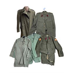 1950s Belgian military uniform including greatcoat, jacket with brass buttons, kit bag, Artillery cap badge and other items and a pair of Cuban military epaulettes 