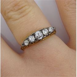 Early 20th century graduating five stone diamond ring, stamped 18ct